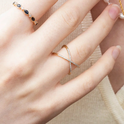 model wearing multi diamond cross solid gold ring