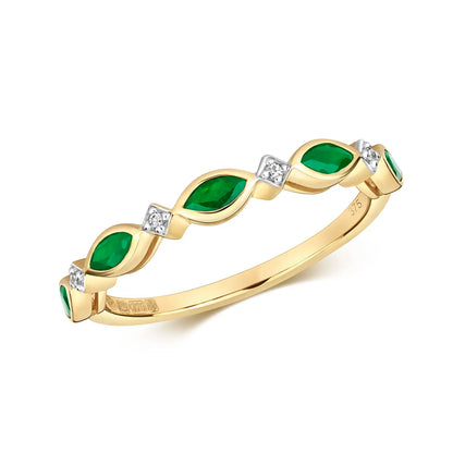 emerald and diamond gold ring on white background