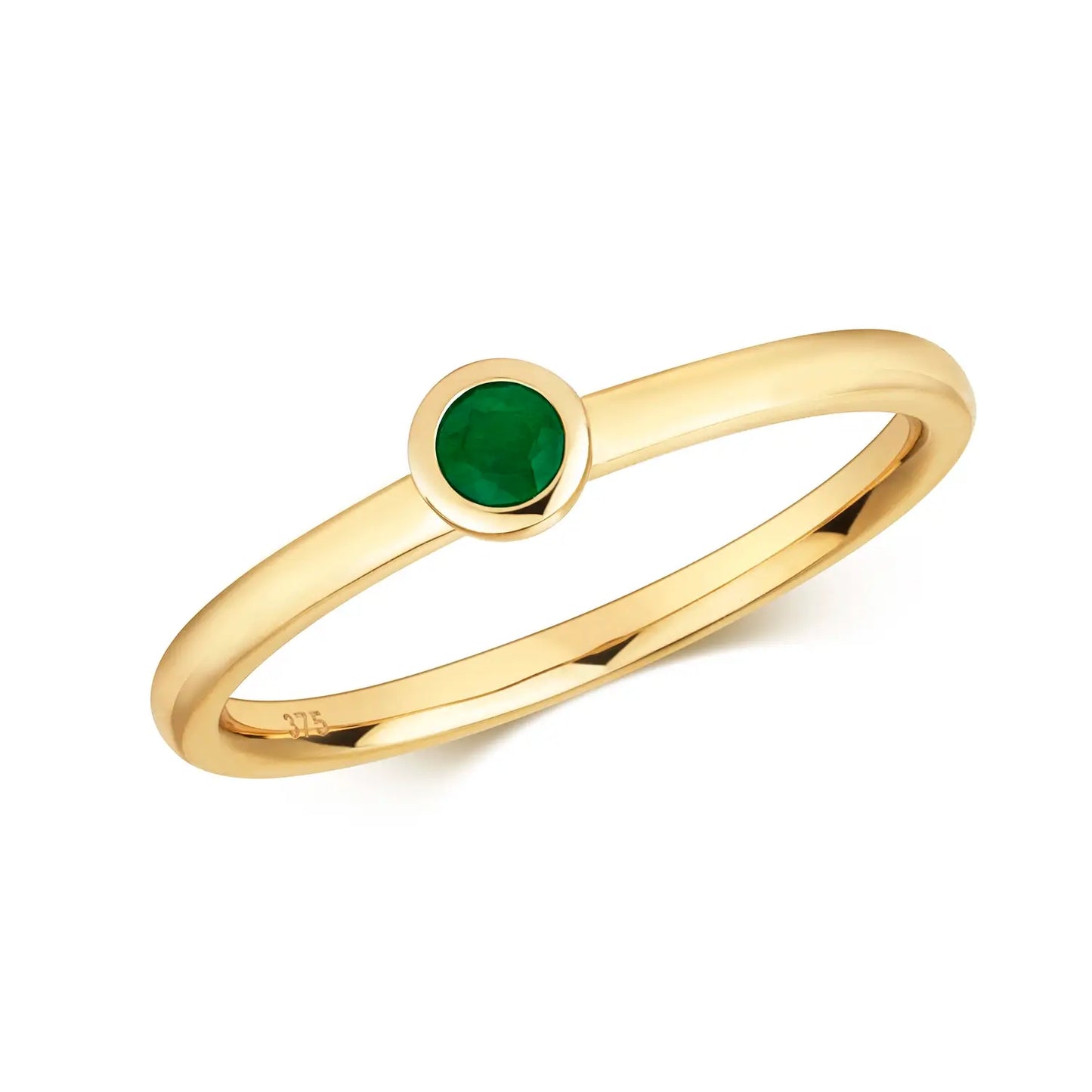 gold emerald ring on white background