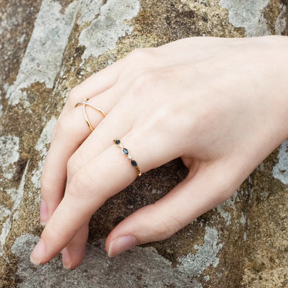 model wearing sapphire and diamond gold ring