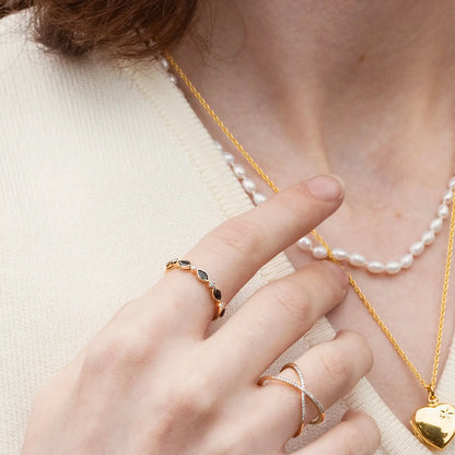 model wearing sapphire and diamond gold ring