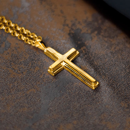 large gold cross necklace, thick gold belcher chain, high polish finish, bevelled edges, religious Christian pendant for men and women, leather background