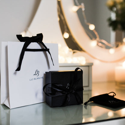 Lily Blanche white ribbon tied gift bag with black ribbon tied gift  box