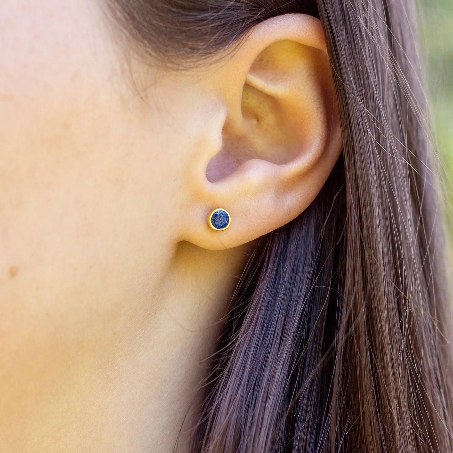 model wearing lapis lazuli gold stud earrings 