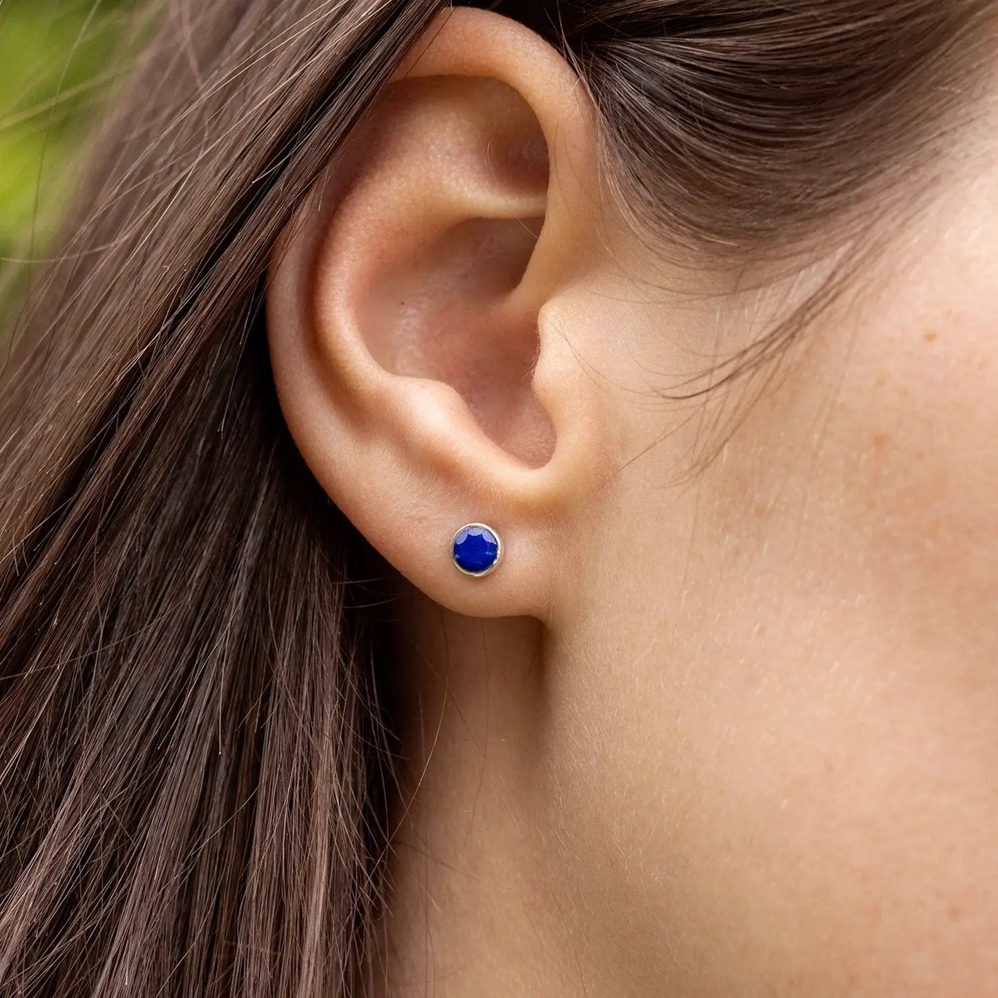 model wearing lapis lazuli rose gold stud earrings 