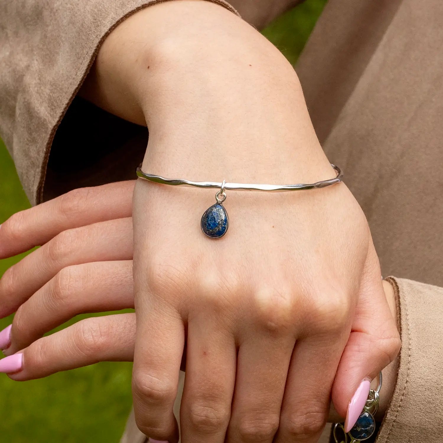 model wearing lapis lazuli bangle silver