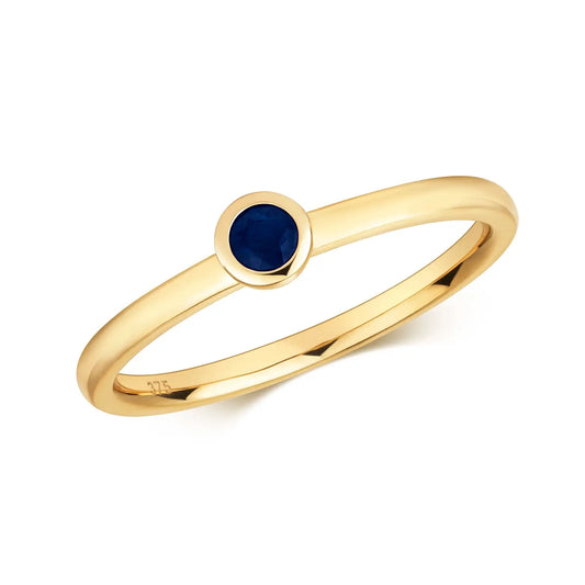 sapphire gold ring on white background