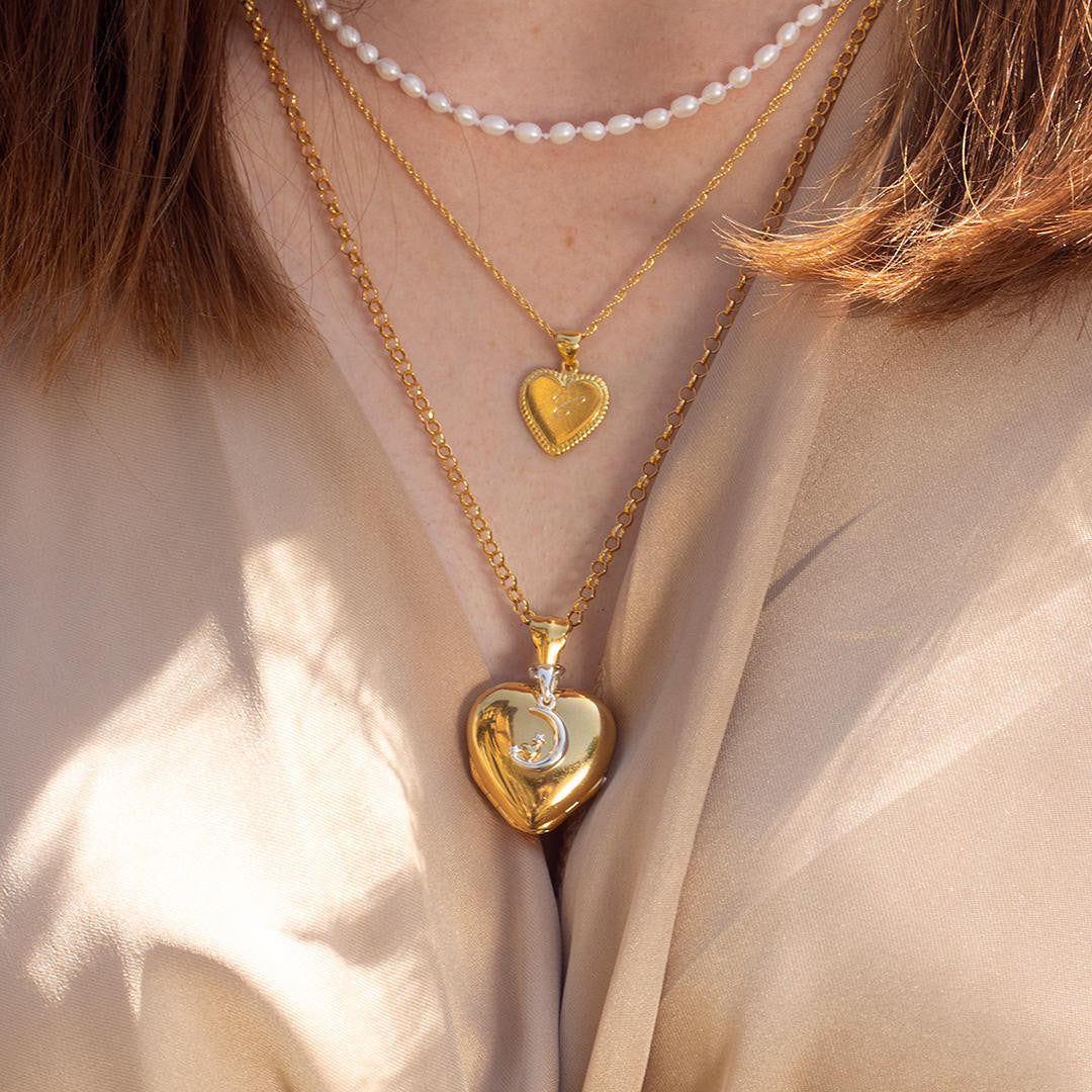 Heart shaped gold store locket necklace